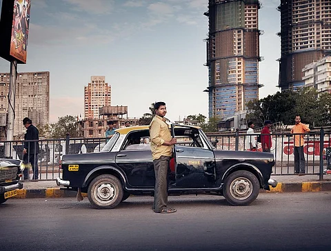 A cab driver with his kaali peeli Premier Padmini in Mumbai