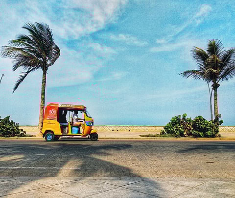 A rickshaw in Puducherry against the blue sky