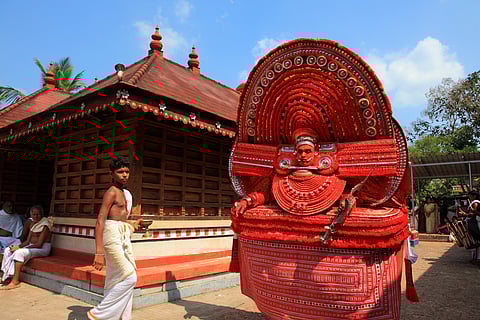 A theyyam artist performs at Kadannappalli Muchilot Bhagavati temple in Kannur