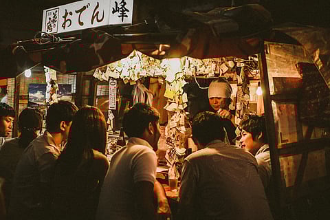 People lined up for food in a Yatai in Fukuoka