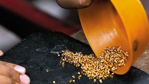 A jeweller at his gold workshop