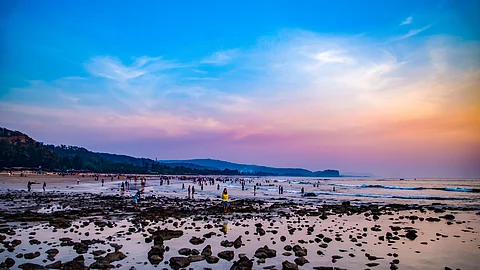 People enjoying the sunset at Kashid Beach, Maharashtra, India