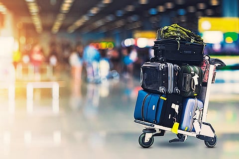 Bags and trolleys on a luggage cart at the airport