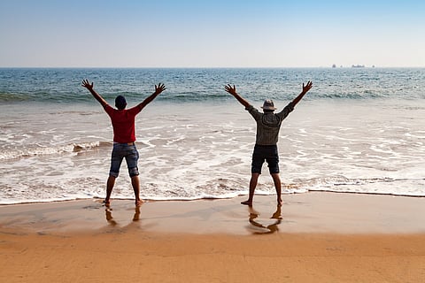 Happy tourist relaxing on Chandrabhaga beach