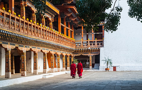 Two buddhist monks at Punakha Dzong, Bhutan