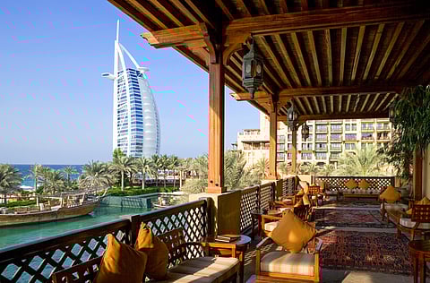 A view of the Burj al Arab tower from inside of a restaurant
