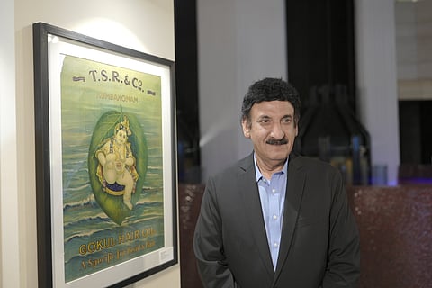 Curator Tarun Thakral posing for a photo at the exhibition