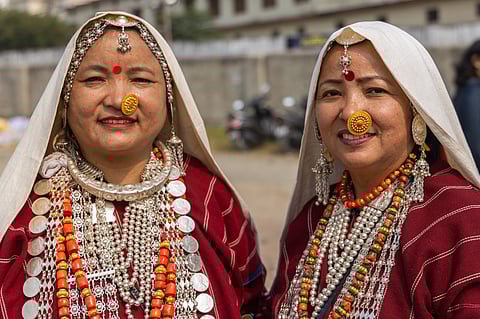 Women adorned in traditional jewellery