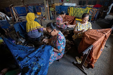 The process of making traditional batik by women workers at the Beruang Batik workshop, Lasem, Central Java