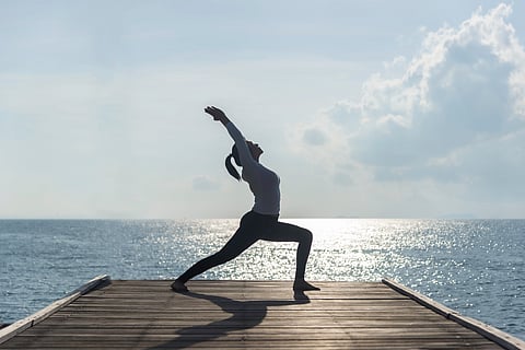 Yoga is a group of physical, mental, and spiritual exercises and disciplines which aim to control and still the mind