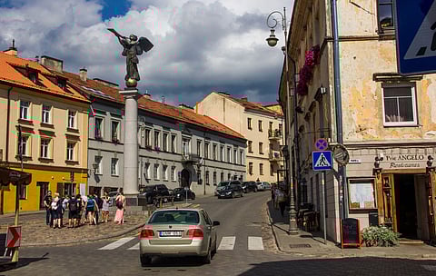 The sculpture of an angel blowing a trumpet in the square