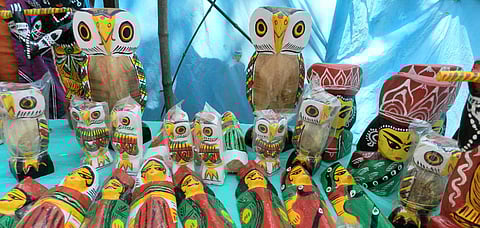 An array of wooden dolls in Natungram
