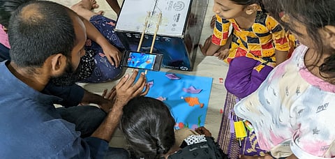 Artist Jerry Antony conducting a stop motion animation workshops with some kids in Govandi.