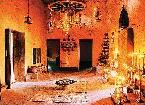 Traditional oil lamps at a Portuguese Hindu priest's mud house