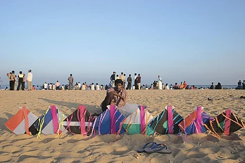 A kite-seller with his wares on Marina Beach, Chennai