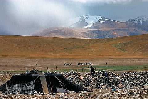 A nomad's tent in the shadows of the Chamser Kangri peak