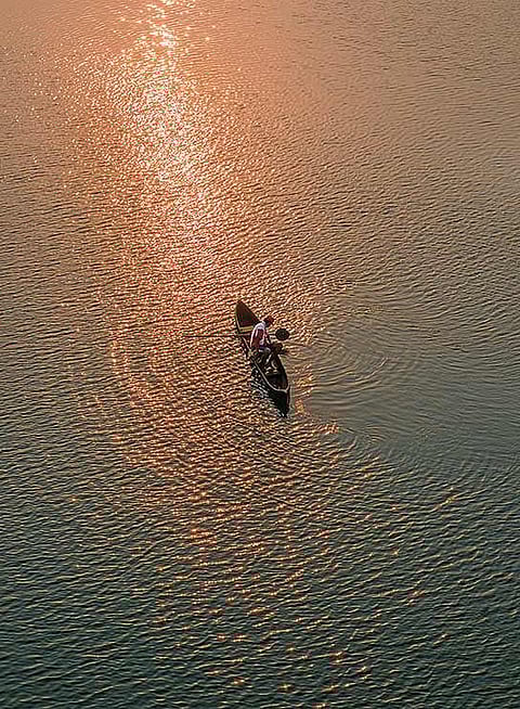 Fishing by the estuary near Siolim Bridge