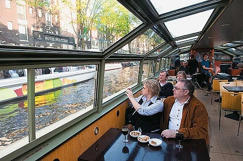 Tourists savour a boat ride