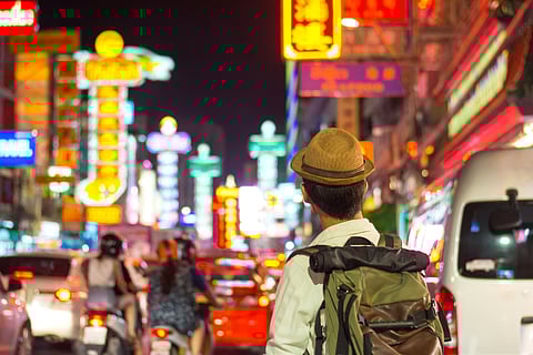 A traveller in Chinatown, Bangkok. Credits Shutterstock