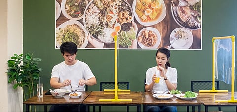 A couple dining while maintaining social distancing