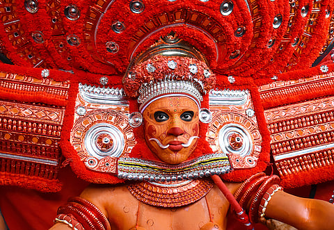 A  Theyyam artist performs during the annual festival at Ramapuram,Puliroopakaali temple in Kannur           RPEES Photography / Shutterstock