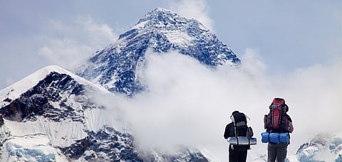 In front of the world's highest mountain