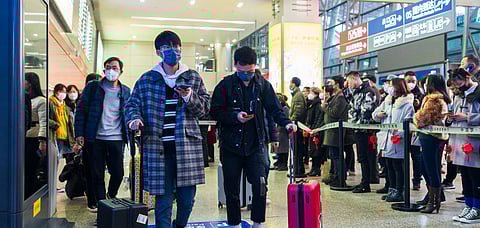 Representative Image Travellers use masks and head to the airport as the restrictions get lifted