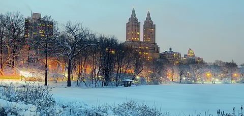 Central Park's winter nights with Manhattan skyscrapers as backdrop