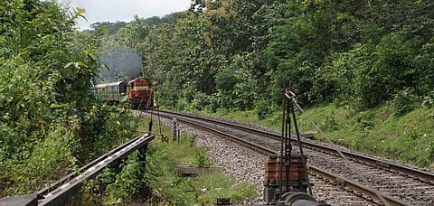 A train track runs through the verdant Western Ghat route of Karnataka