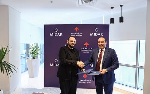 خلال توقيع الاتفاقية بين "مدينة مصر" و"ميدار"