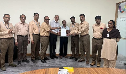 Senior officers of BEL and Emjay Control Systems Pvt Ltd display the MoU signed between both the companies for joint manufacture and business development of bollards for strategic use