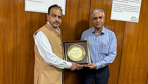 REIL MD Rakesh Chopra receives a special memento from DNV