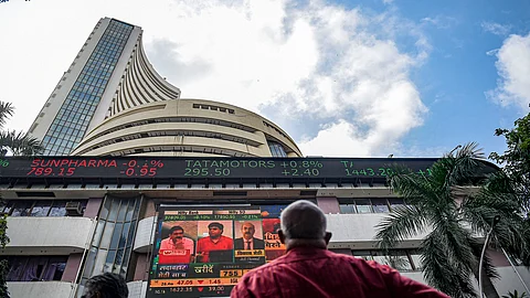 Markets trade lower after initial optimism ahead of RBI policy decision