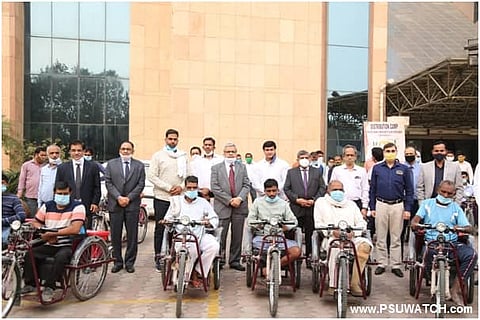 CSR: REMCL distributes motorised tricycles among Divyangjans