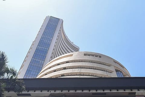 Benchmark indices trade higher on global market trends
