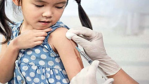 मुलांचे लसीकरण करताना…
