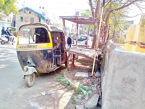 A wrecked vehicle in a state of disrepair.