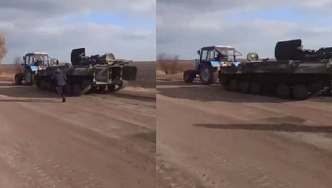 Russia-Ukraine War : युक्रेनच्या शेतकऱ्यानं चक्क ट्रॅक्टरनं रशियन रणगाडाच पळवला (video)