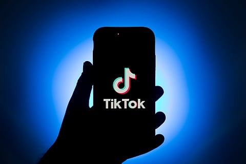 The logo for ByteDance Ltd.'s TikTok app is displayed on a smartphone in an arranged photograph in Sydney, New South Wales, Australia, on Monday Sept.14, 2020. *** SECOND SENTENCE HERE ***. Photographer: Brent Lewin/Bloomberg