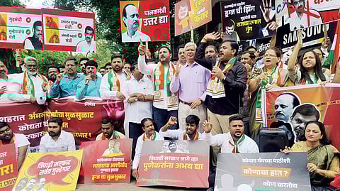NCP officials and activists protesting in front of a pub on Ferguson Street