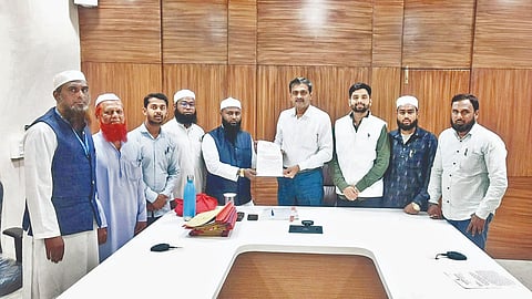 Officials of Madani Trust while giving a statement.