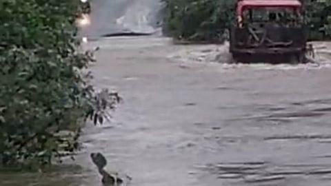 The tractor was swept away in the river flood