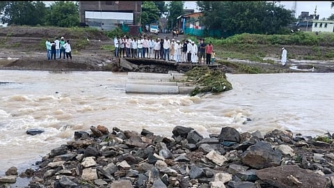 The bridge over the Anjana river was swept away by the flood, bringing the traffic to a standstill