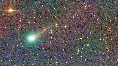 lemon colored comet passing near earth