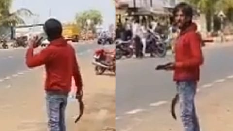 கையில் அரிவாளுடன் நிற்கும்
பிரவீன்