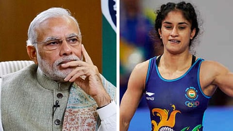 மோடி - மல்யுத்த வீராங்கனை வினேஷ் போகத்