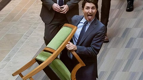 justin trudeau exits parliament with chair in hand
