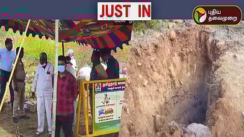 உடலை தோண்டி எடுக்கும் பணியில்