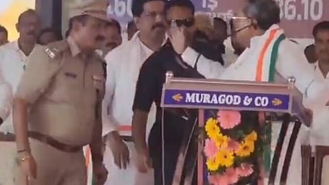 karnataka cm siddaramaiah attempts to slap an on duty police officer