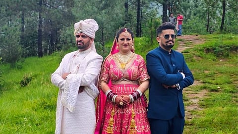 Bride Sunita Chauhan with her grooms Pradeep (left) and Kapil Negi